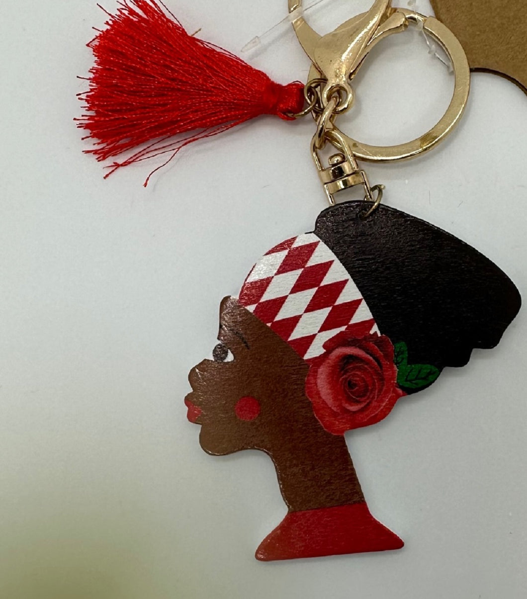 Gold Keychain with Black Girl in Multi Colored Head Band and Red Tassel