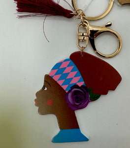Gold Keychain with Black Girl in Multi Colored Head Band and Burgundy Tassel