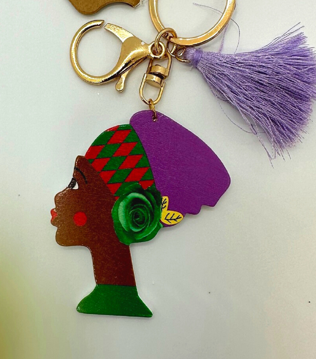 Gold Keychain with Black Girl in Multi Colored Head Band and Purple Tassel