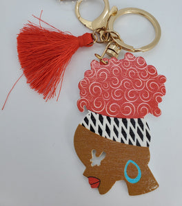 Gold Keychain with Black Girl in Multi Colored Head Band Ponytail Red Tassel
