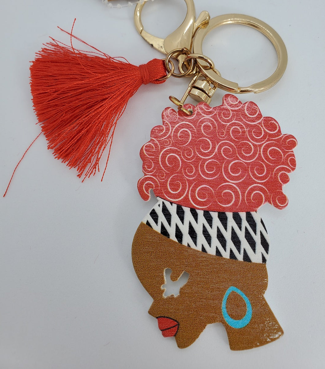 Gold Keychain with Black Girl in Multi Colored Head Band Ponytail Red Tassel