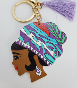 Gold Keychain with Black Girl in Multi Colored Wool Hat and Purple Tassel